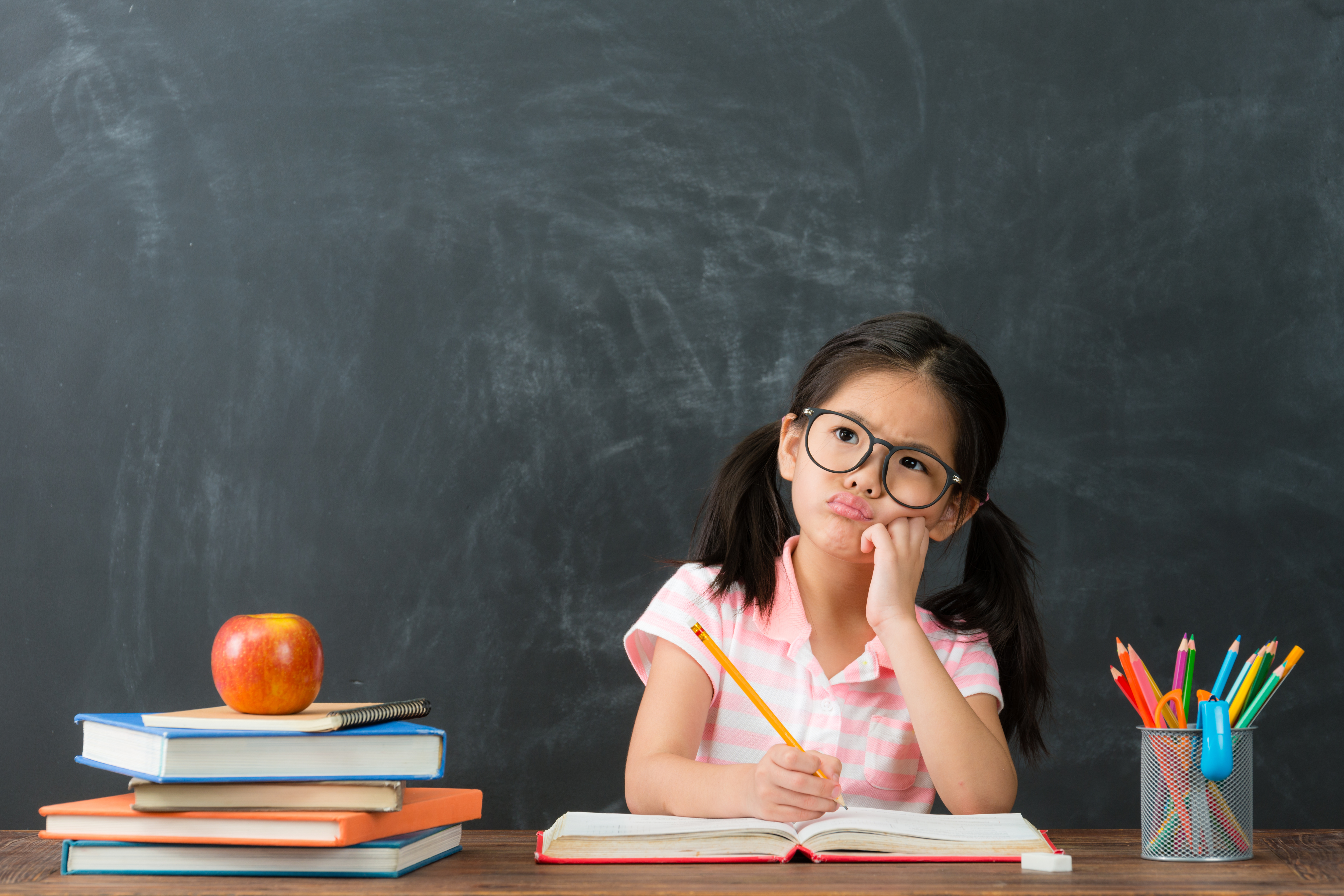Kid thinking about school work