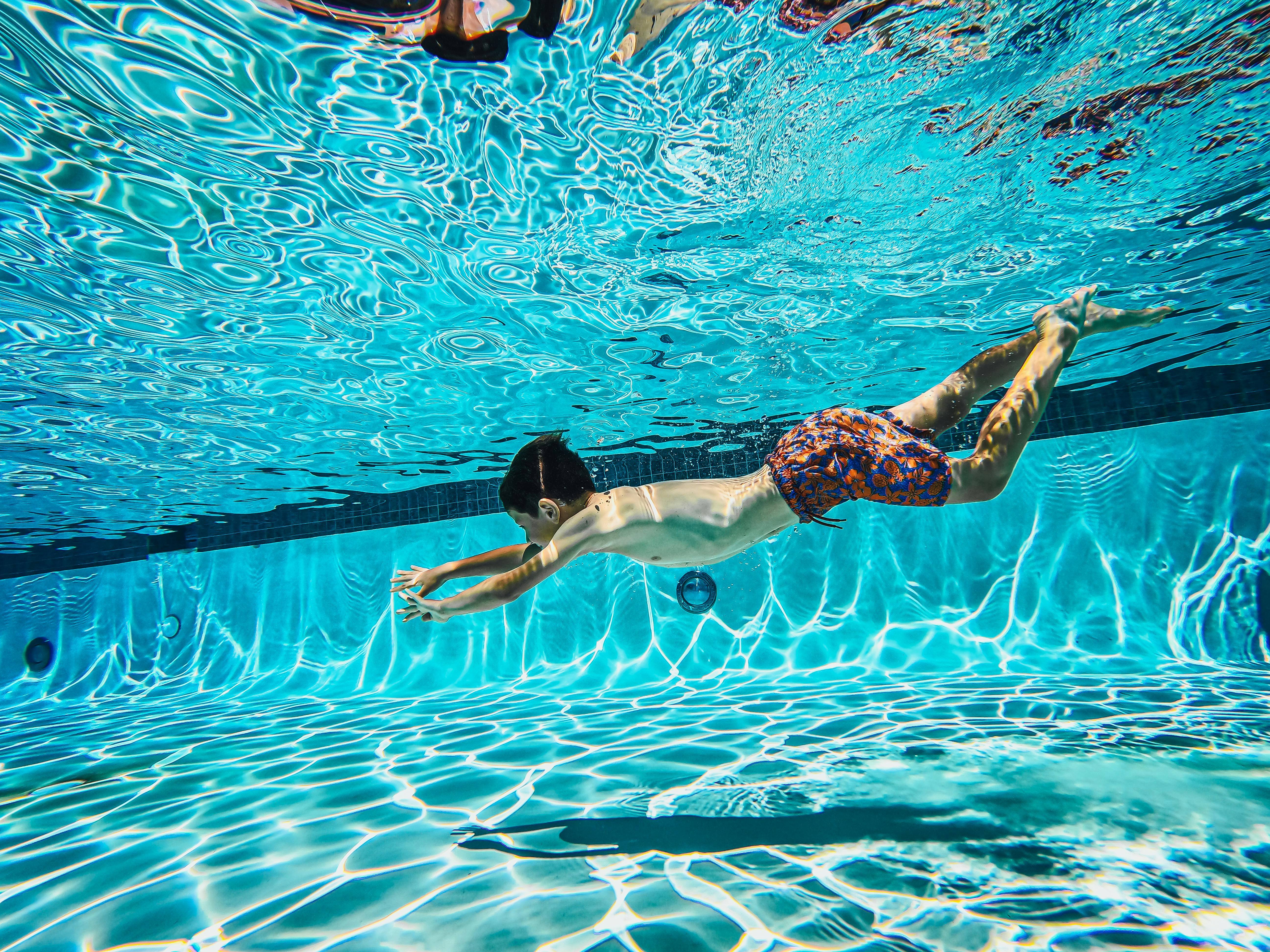 Child dives into a Swimming Pool